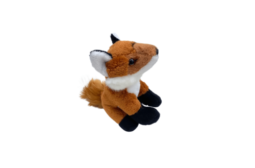 Wild Ireland - The Fox soft toy small is a seated plush fox with brown fur, white accents on its face and tail, and black paws. Its slightly facing right against a plain white background.