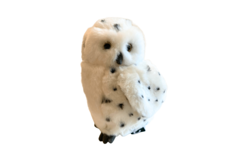 Wild Ireland - The Snowy Owl Medium Soft Toy features white fur with black speckles, resembling a snowy owl. It is set against a plain white background, and its large dark eyes enhance its realistic appearance.