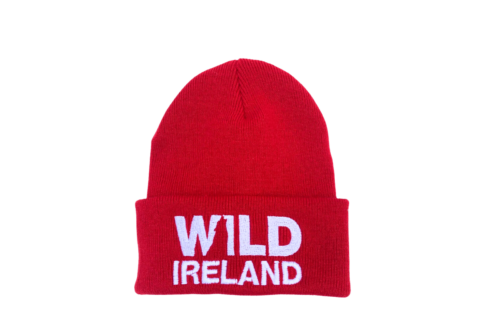 Wild Ireland - The Kids Beanie Red features WILD IRELAND embroidered in white on the front against a white background.